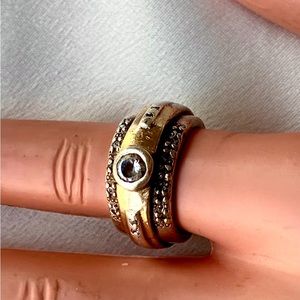 Silver and gold ring with stone .